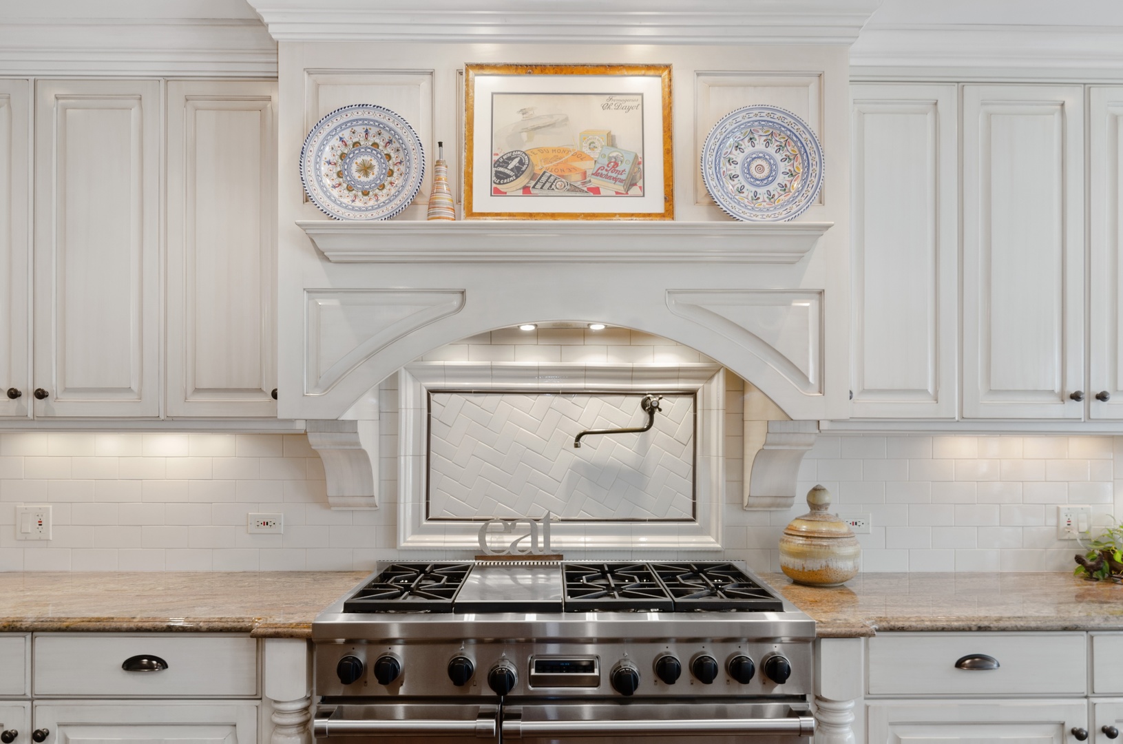 672 Elder Lane Winnetka, IL 60093 - Photo 10 of 32 a stove top oven sitting inside of a kitchen