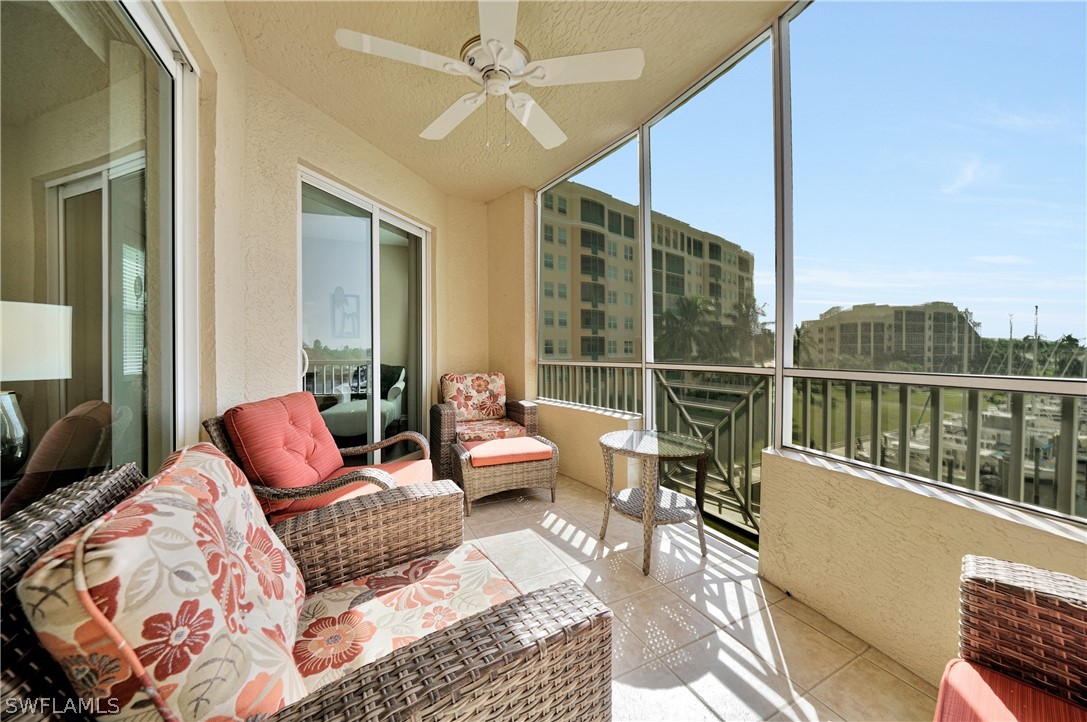 2060 Matecumbe Key Road, Unit 2302 Punta Gorda, FL 33955 - Photo 23 of 30 a living room with furniture and a floor to ceiling window