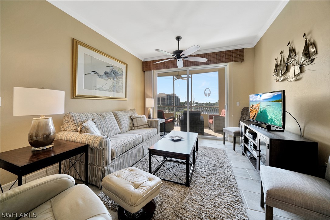 2060 Matecumbe Key Road, Unit 2302 Punta Gorda, FL 33955 - Photo 9 of 30 a living room with furniture and a flat screen tv