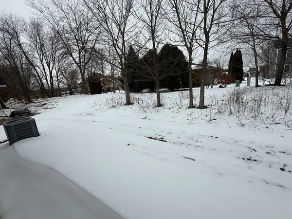 a very nice looking kitchen with center island stainless steel appliances and wooden floor