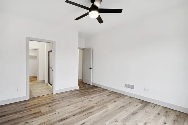 a open kitchen with stainless steel appliances granite countertop a sink a stove and a wooden floors