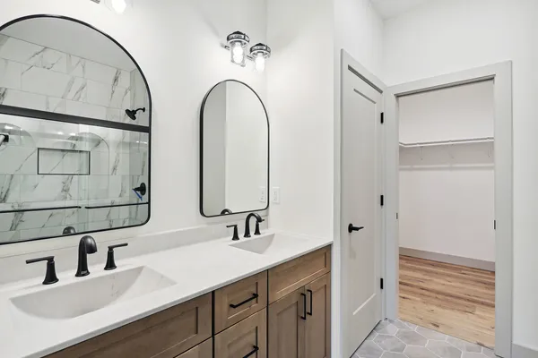 a bathroom with a tub and a shower