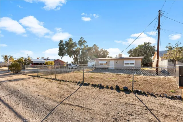 a kitchen with stainless steel appliances a stove a refrigerator and a stove