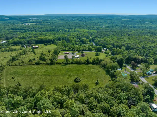 a view of a roof deck with furniture