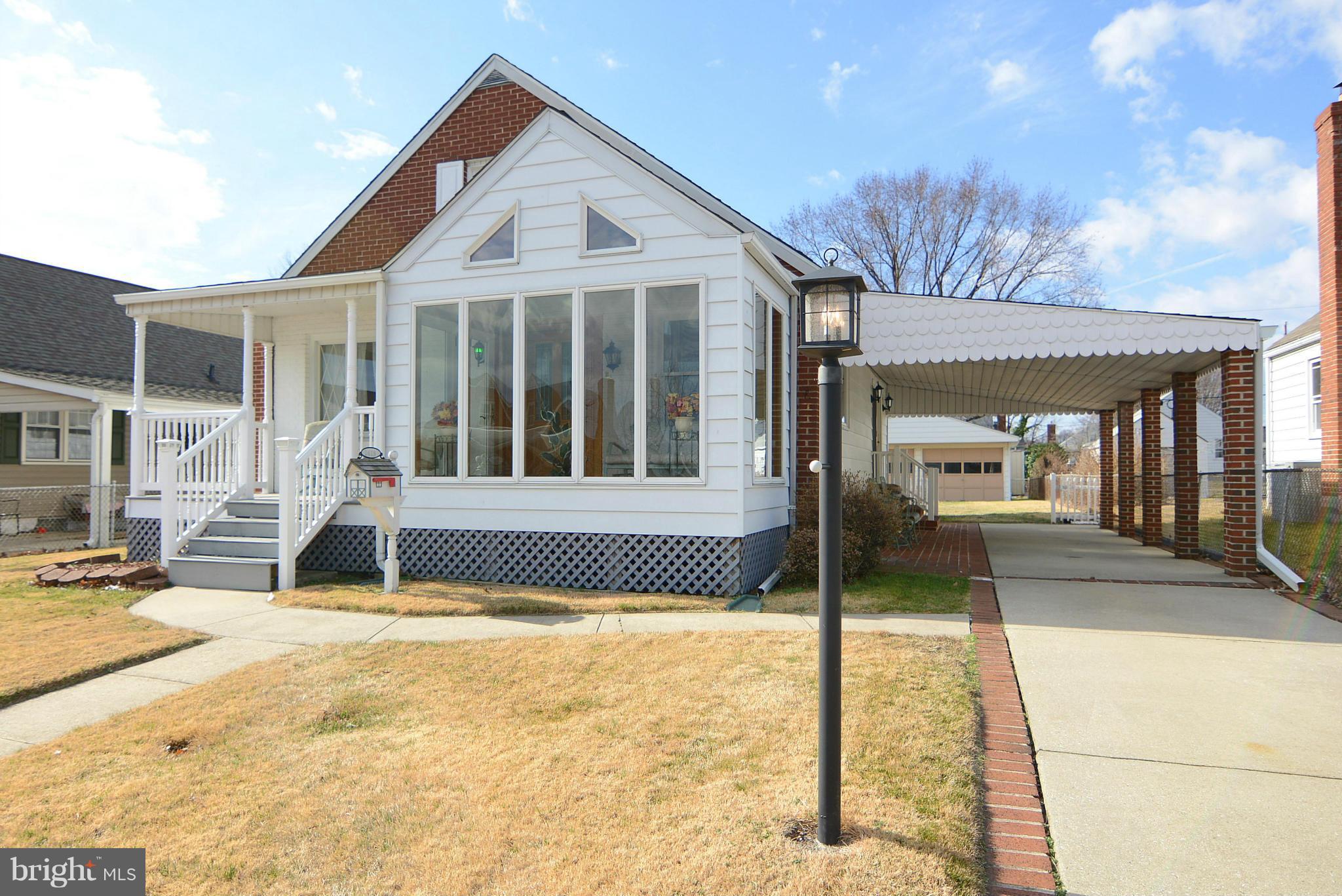 2618 Ambler Road Baltimore, MD 21222 - Photo 1 of 30 a front view of a house with a porch