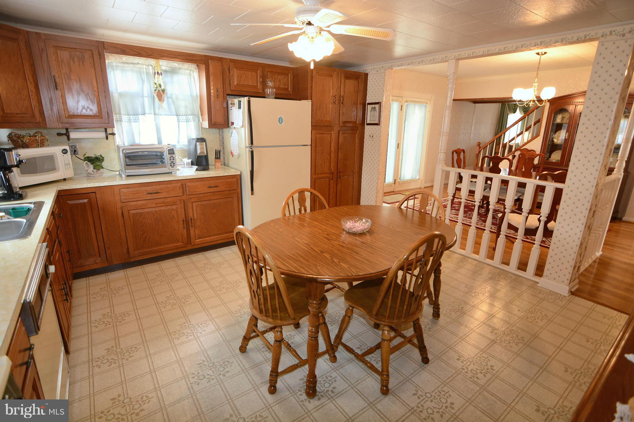 2618 Ambler Road Baltimore, MD 21222 - Photo 14 of 30 a dining room with furniture and window