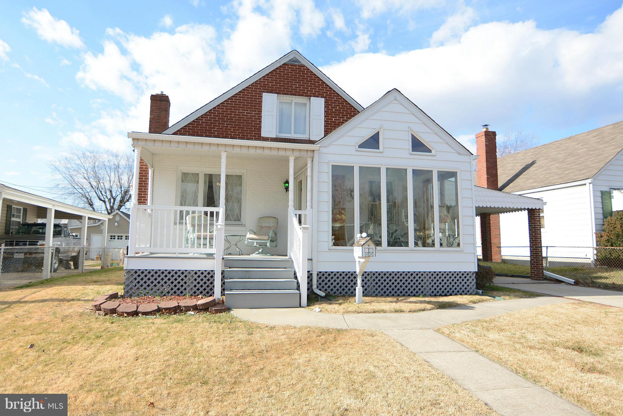 2618 Ambler Road Baltimore, MD 21222 - Photo 3 of 30 a front view of a house with a yard