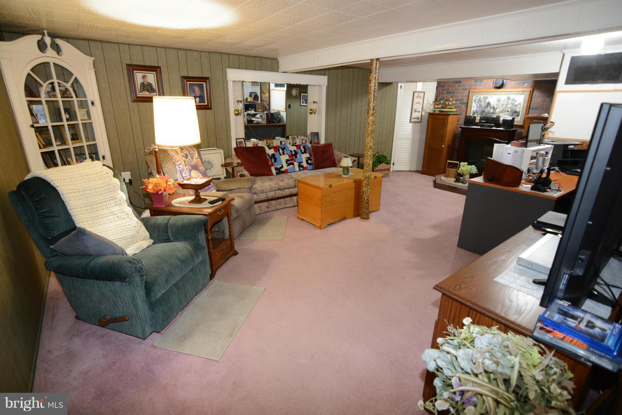 2618 Ambler Road Baltimore, MD 21222 - Photo 22 of 30 a living room with furniture fireplace and flat screen tv