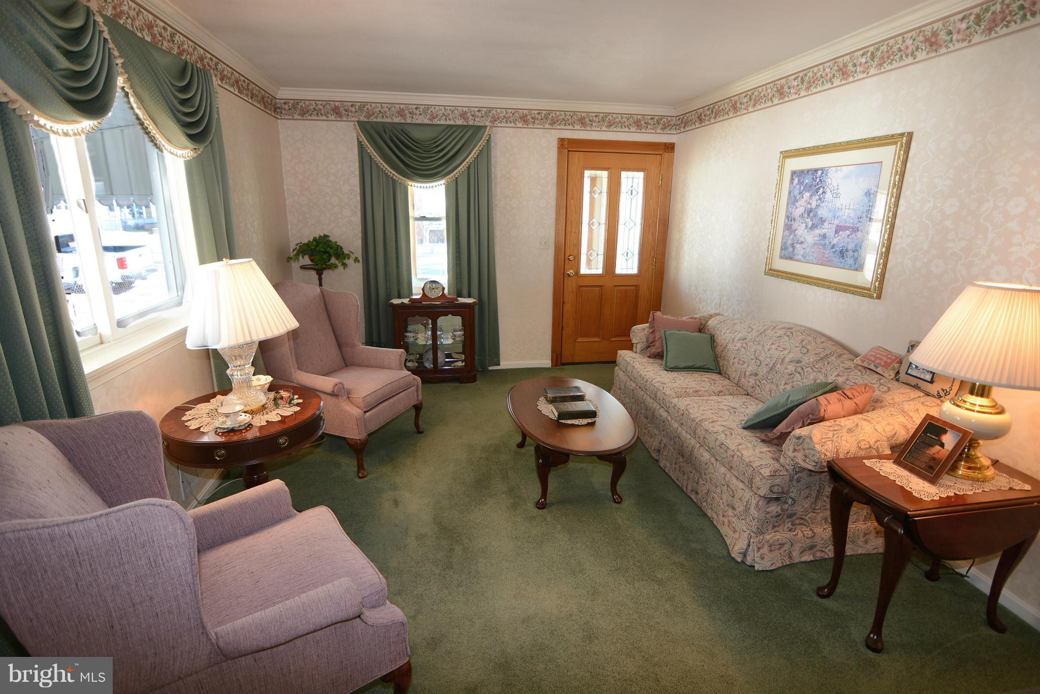 2618 Ambler Road Baltimore, MD 21222 - Photo 7 of 30 a living room with furniture or couch and a window