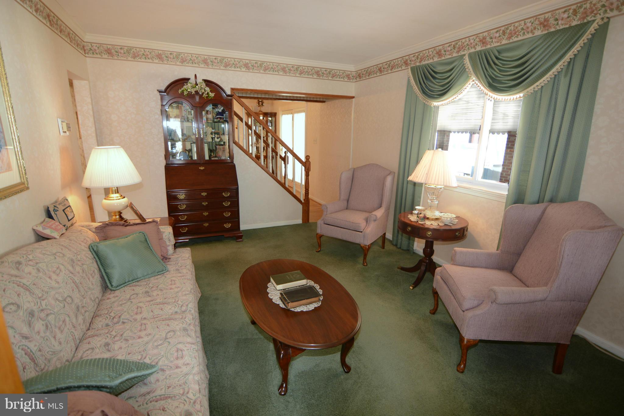 2618 Ambler Road Baltimore, MD 21222 - Photo 8 of 30 a living room with furniture and a wooden floor