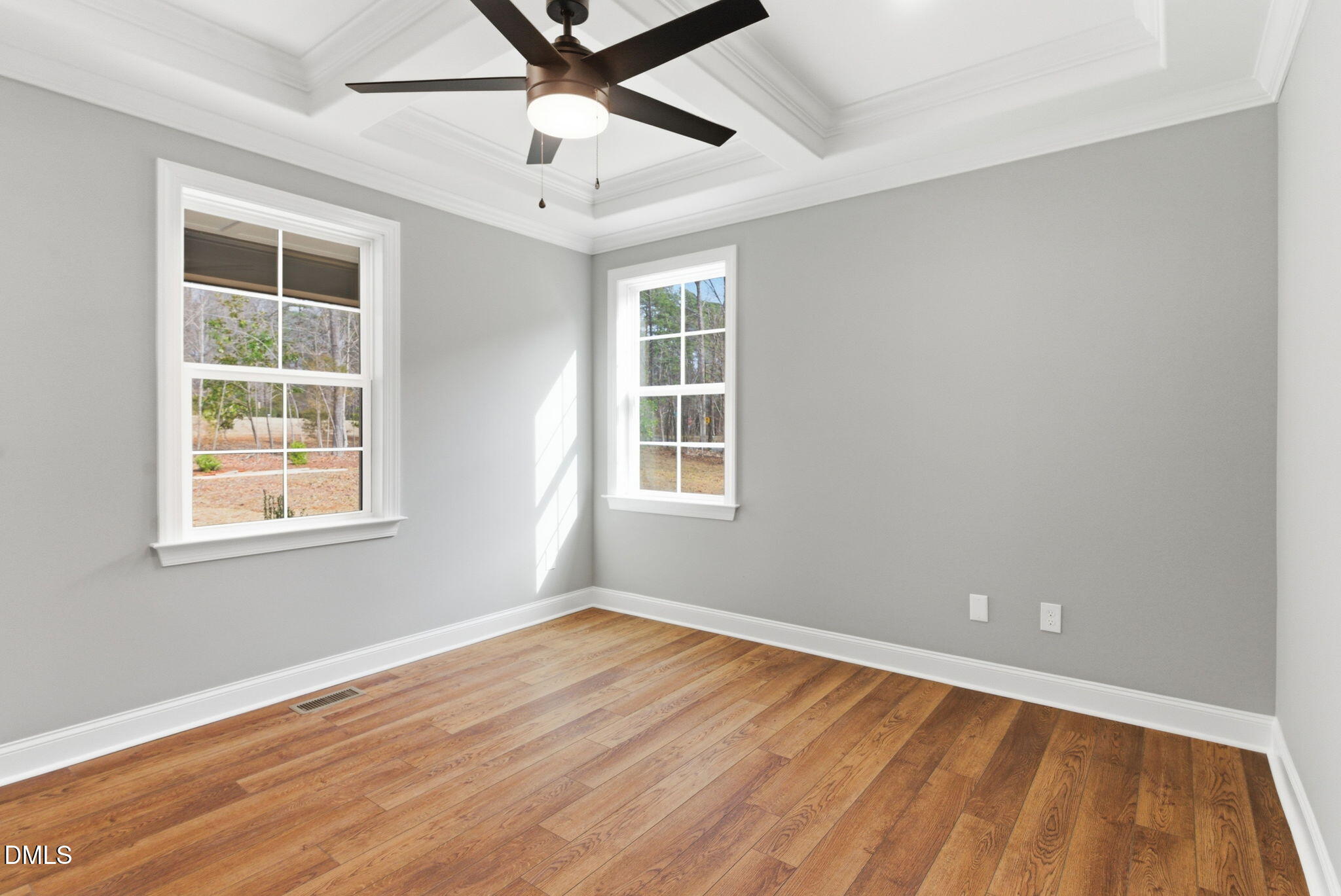 3649 Saxapahaw-Bethlehem Church Road Mebane, NC 27302 - Photo 12 of 69 an empty room with wooden floor fan and windows