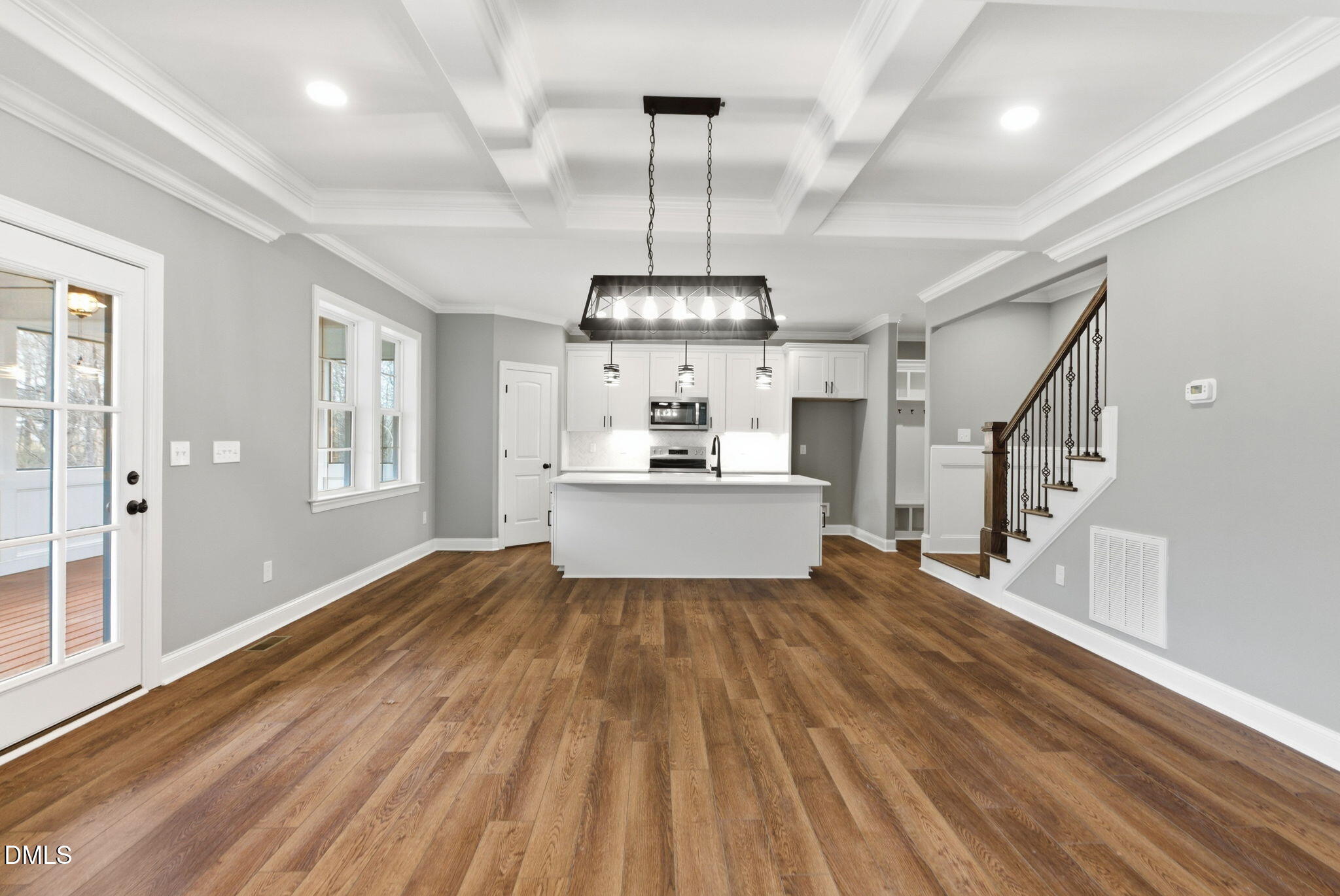 3649 Saxapahaw-Bethlehem Church Road Mebane, NC 27302 - Photo 17 of 69 a view of a kitchen with wooden floor and a ceiling fan