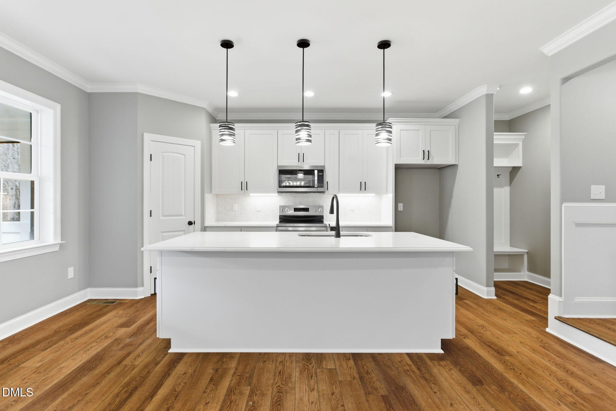 3649 Saxapahaw-Bethlehem Church Road Mebane, NC 27302 - Photo 20 of 69 a large kitchen with cabinets wooden floor and a stainless steel appliances