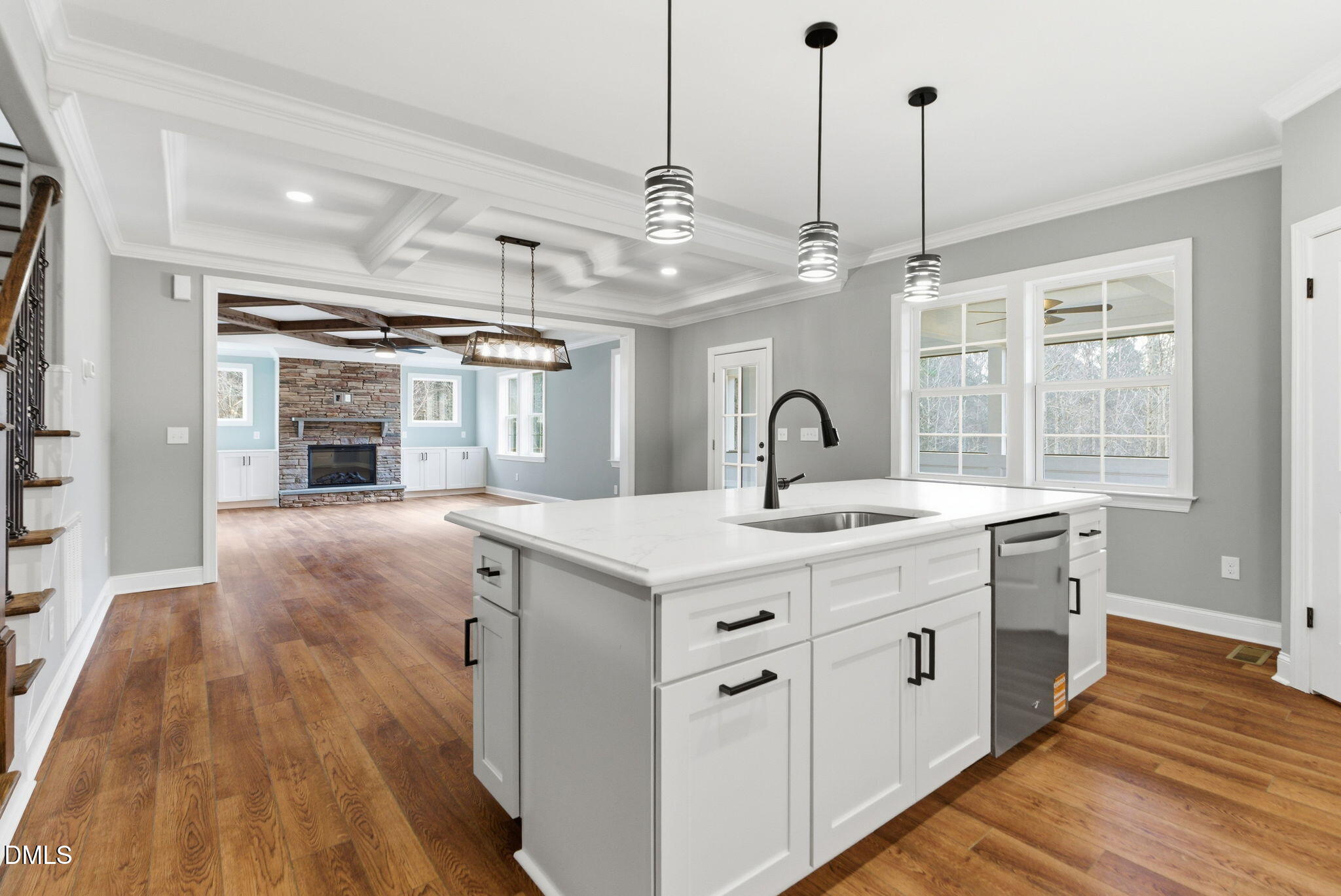 3649 Saxapahaw-Bethlehem Church Road Mebane, NC 27302 - Photo 25 of 69 a kitchen with kitchen island a stove a sink a center island and wooden floor