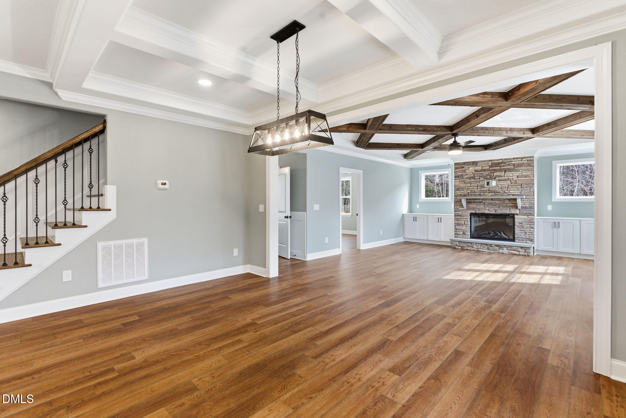 3649 Saxapahaw-Bethlehem Church Road Mebane, NC 27302 - Photo 26 of 69 a view of a livingroom with wooden floor a ceiling fan and window