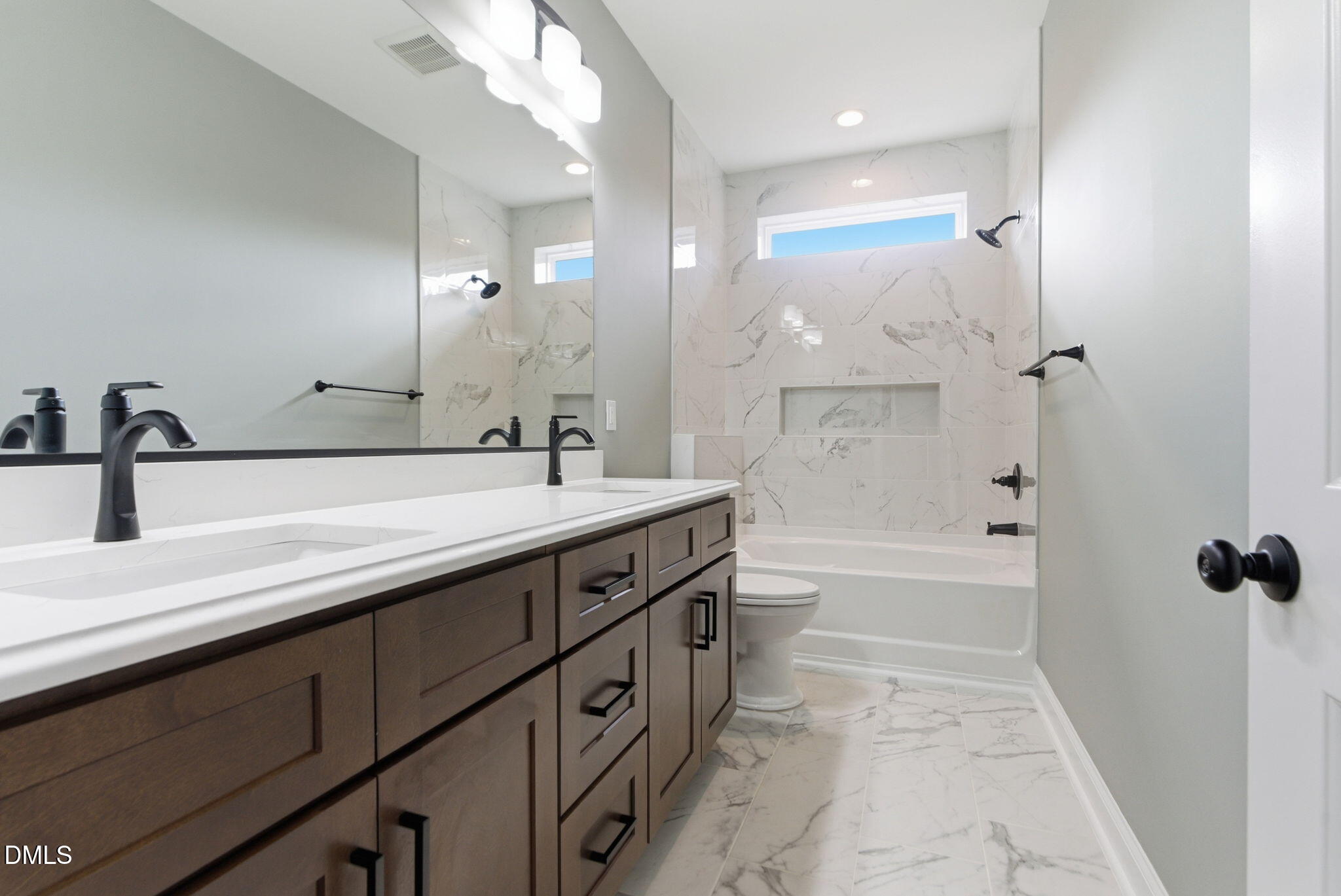 3649 Saxapahaw-Bethlehem Church Road Mebane, NC 27302 - Photo 42 of 69 a bathroom with a double vanity sink a toilet and shower