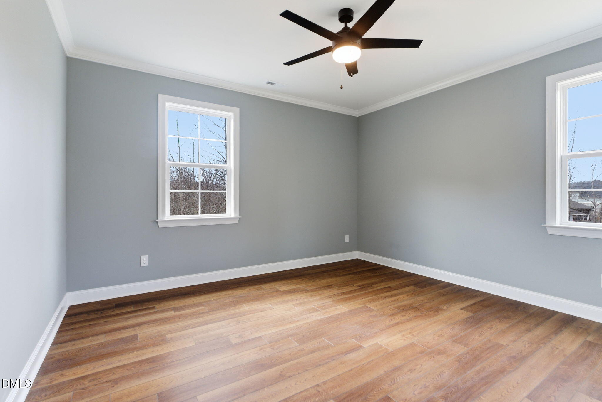 3649 Saxapahaw-Bethlehem Church Road Mebane, NC 27302 - Photo 43 of 69 a view of a big room with wooden floor and windows