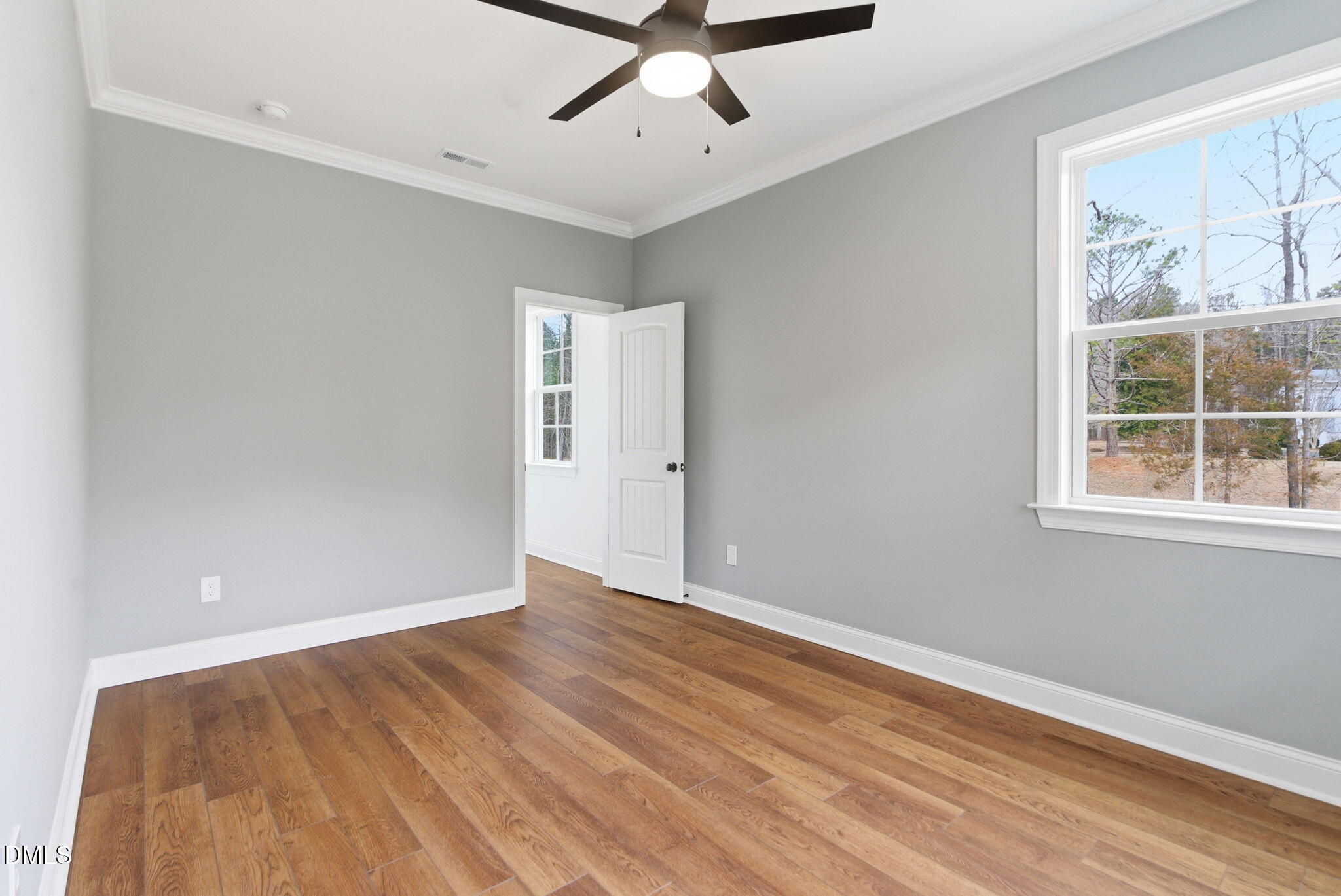 3649 Saxapahaw-Bethlehem Church Road Mebane, NC 27302 - Photo 44 of 69 wooden floor in an empty room with a window