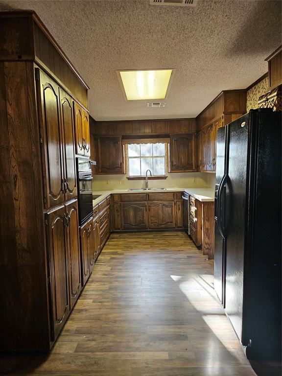 1447 Red Gate Road Mart, TX 76664 - Photo 5 of 19 a kitchen with stainless steel appliances granite countertop a refrigerator and a sink