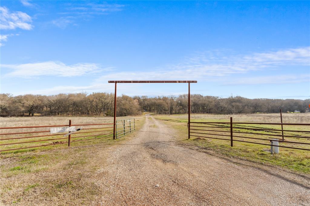 1447 Red Gate Road Mart, TX 76664 - Photo 6 of 38 a view of outdoor space with deck and yard