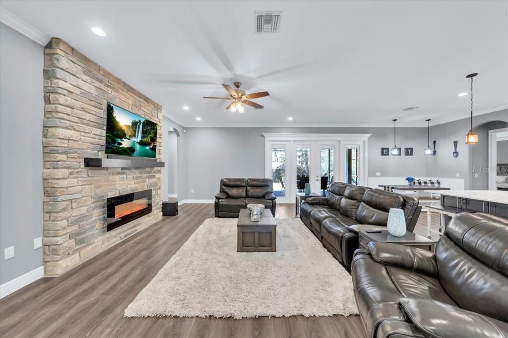 8011 Revels Road Riverview, FL 33569 - Photo 13 of 38 a living room with furniture and a flat screen tv