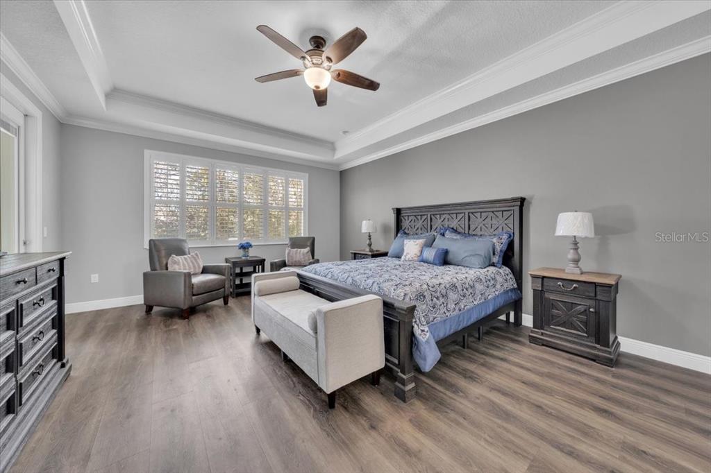 8011 Revels Road Riverview, FL 33569 - Photo 15 of 38 a bedroom with a bed couch and a large window