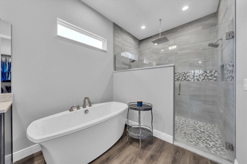 8011 Revels Road Riverview, FL 33569 - Photo 18 of 38 a bathroom with a bathtub and shower