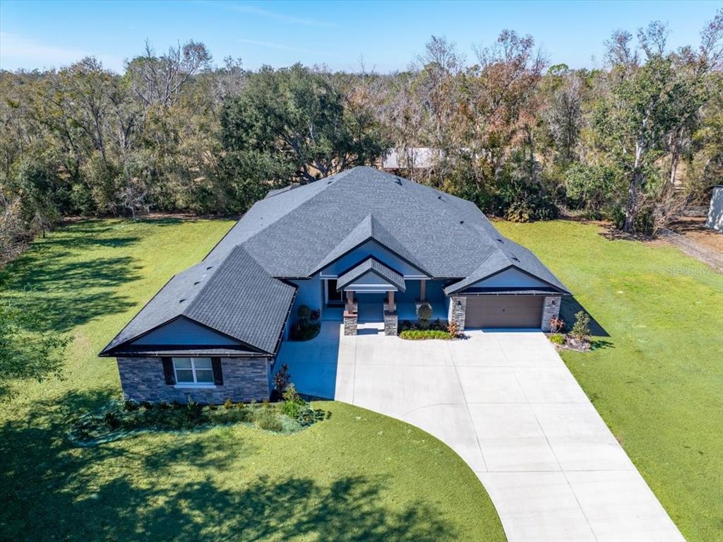 8011 Revels Road Riverview, FL 33569 - Photo 2 of 38 a house with trees in the background