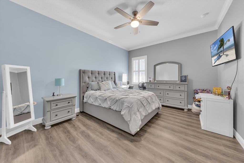 8011 Revels Road Riverview, FL 33569 - Photo 22 of 38 a bedroom with a bed and a cabinets