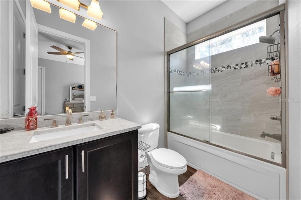 8011 Revels Road Riverview, FL 33569 - Photo 25 of 38 a bathroom with a sink a toilet and shower