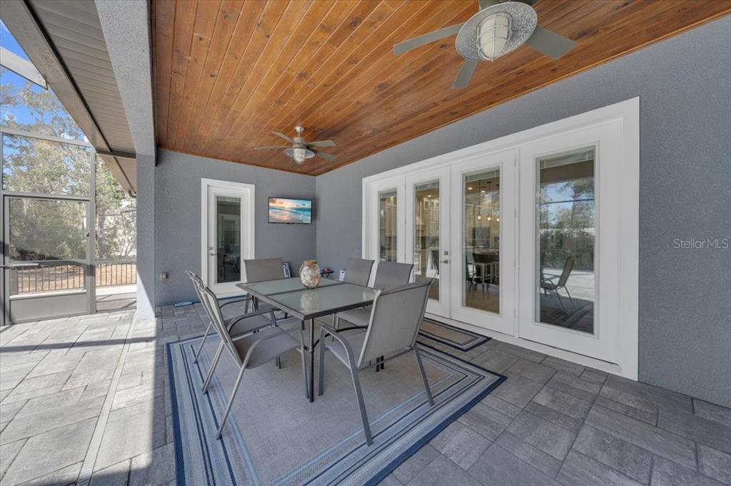 8011 Revels Road Riverview, FL 33569 - Photo 29 of 38 a view of a dining room with furniture wooden floor and a chandelier