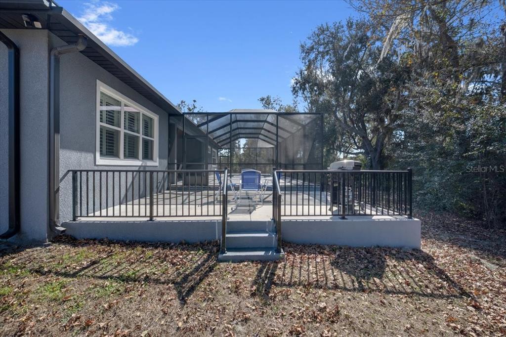 8011 Revels Road Riverview, FL 33569 - Photo 34 of 38 a view of a chair and table in the deck