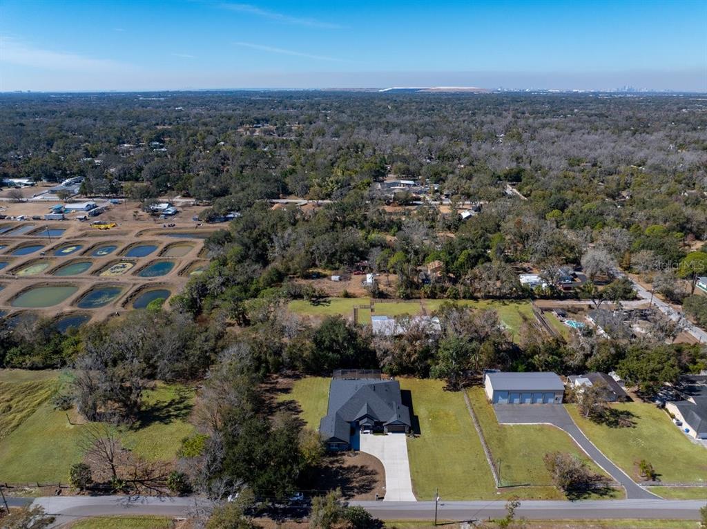 8011 Revels Road Riverview, FL 33569 - Photo 35 of 38 an aerial view of residential houses with outdoor space and trees