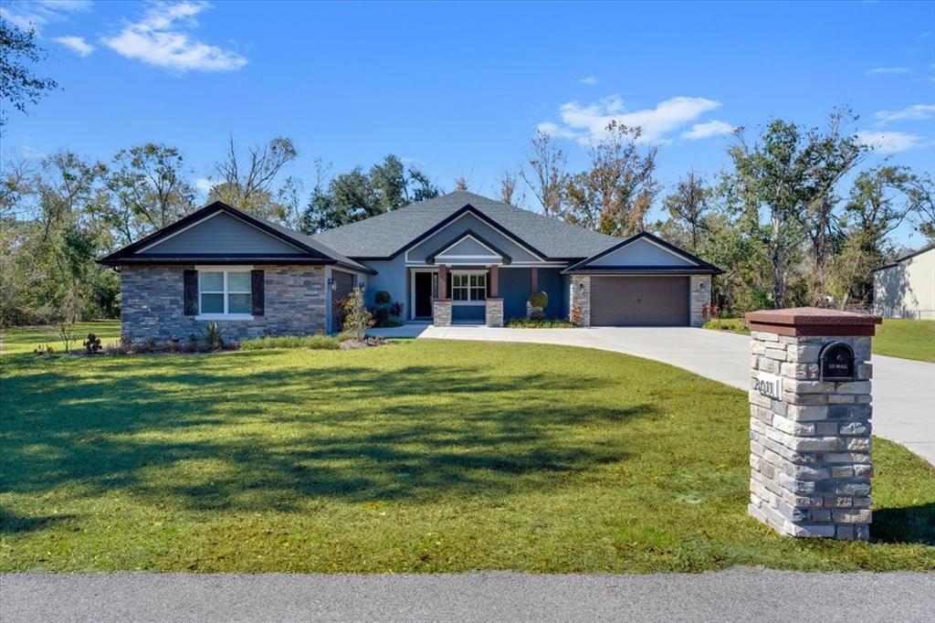 8011 Revels Road Riverview, FL 33569 - Photo 38 of 38 a front view of a house with a garden