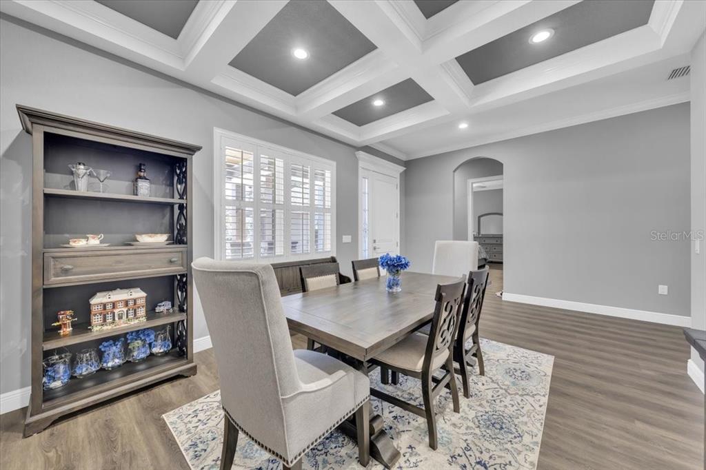8011 Revels Road Riverview, FL 33569 - Photo 7 of 38 a view of a dining room with furniture window and wooden floor