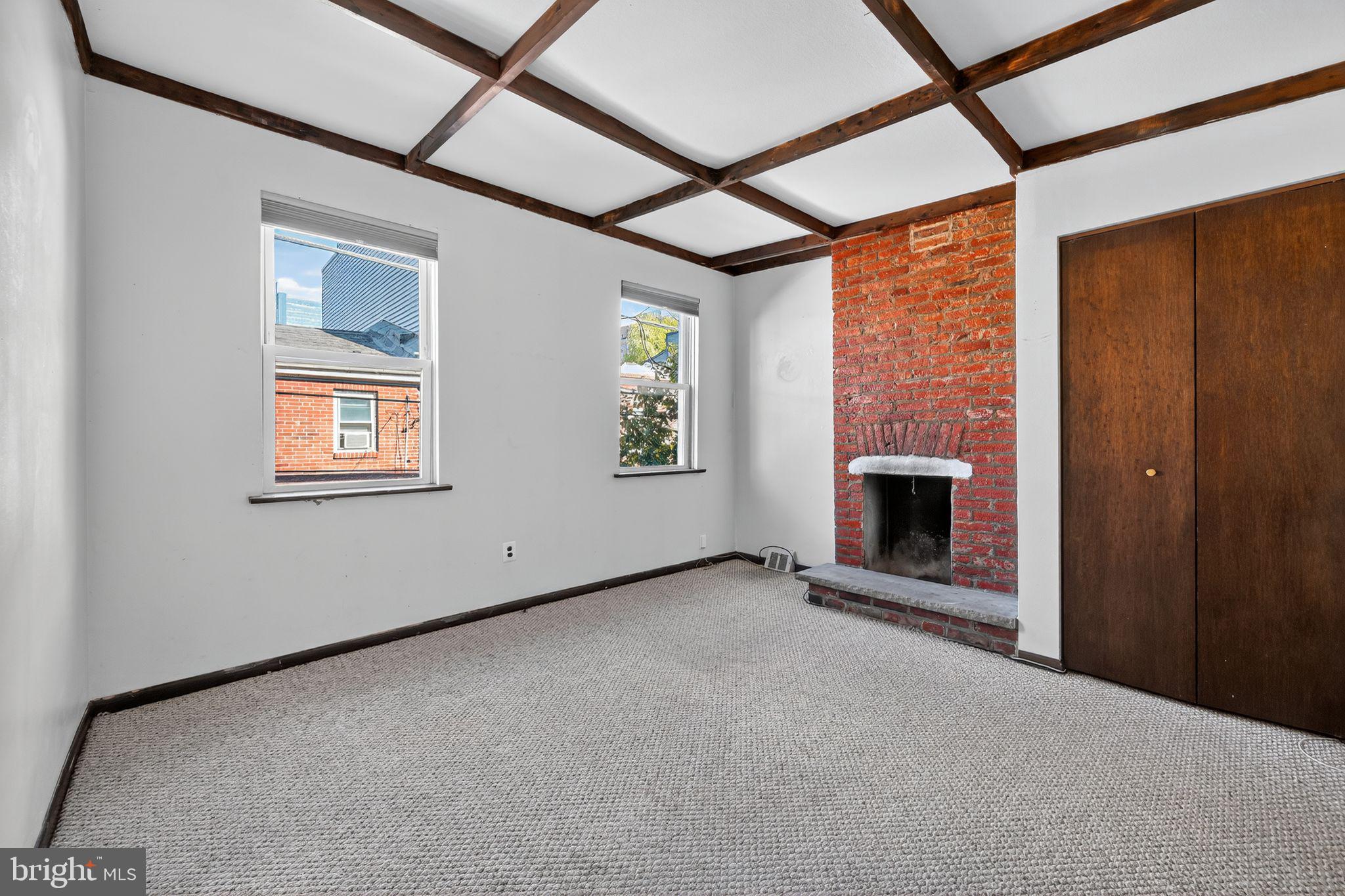 1930 Kater Street Philadelphia, PA 19146 - Photo 13 of 30 a view of an empty room with a fireplace and a window