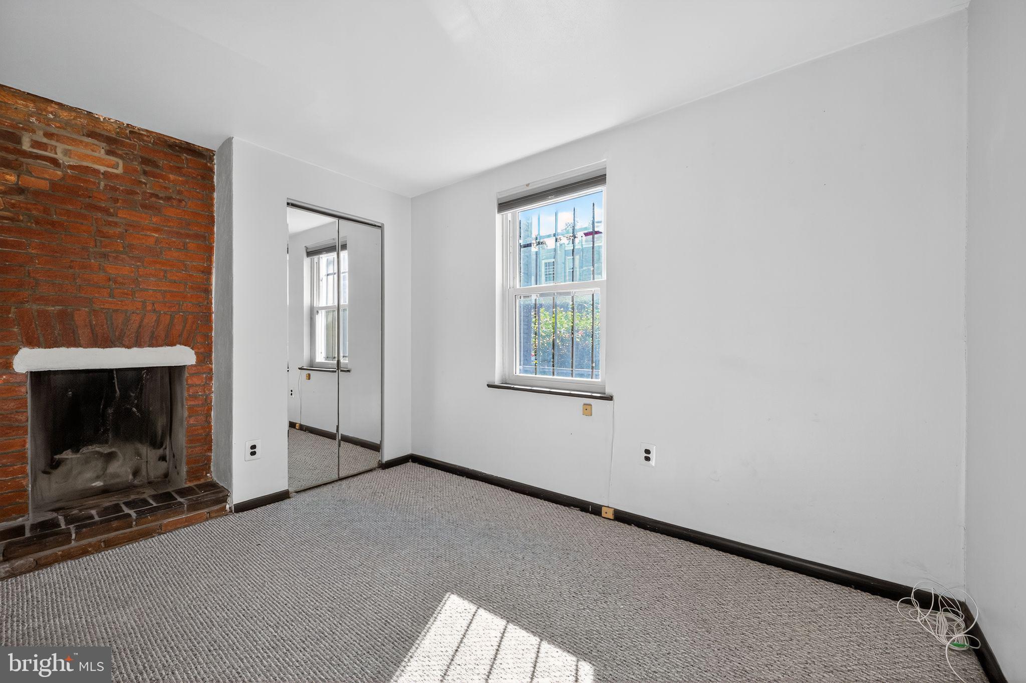 1930 Kater Street Philadelphia, PA 19146 - Photo 16 of 30 a view of empty room with window and fireplace