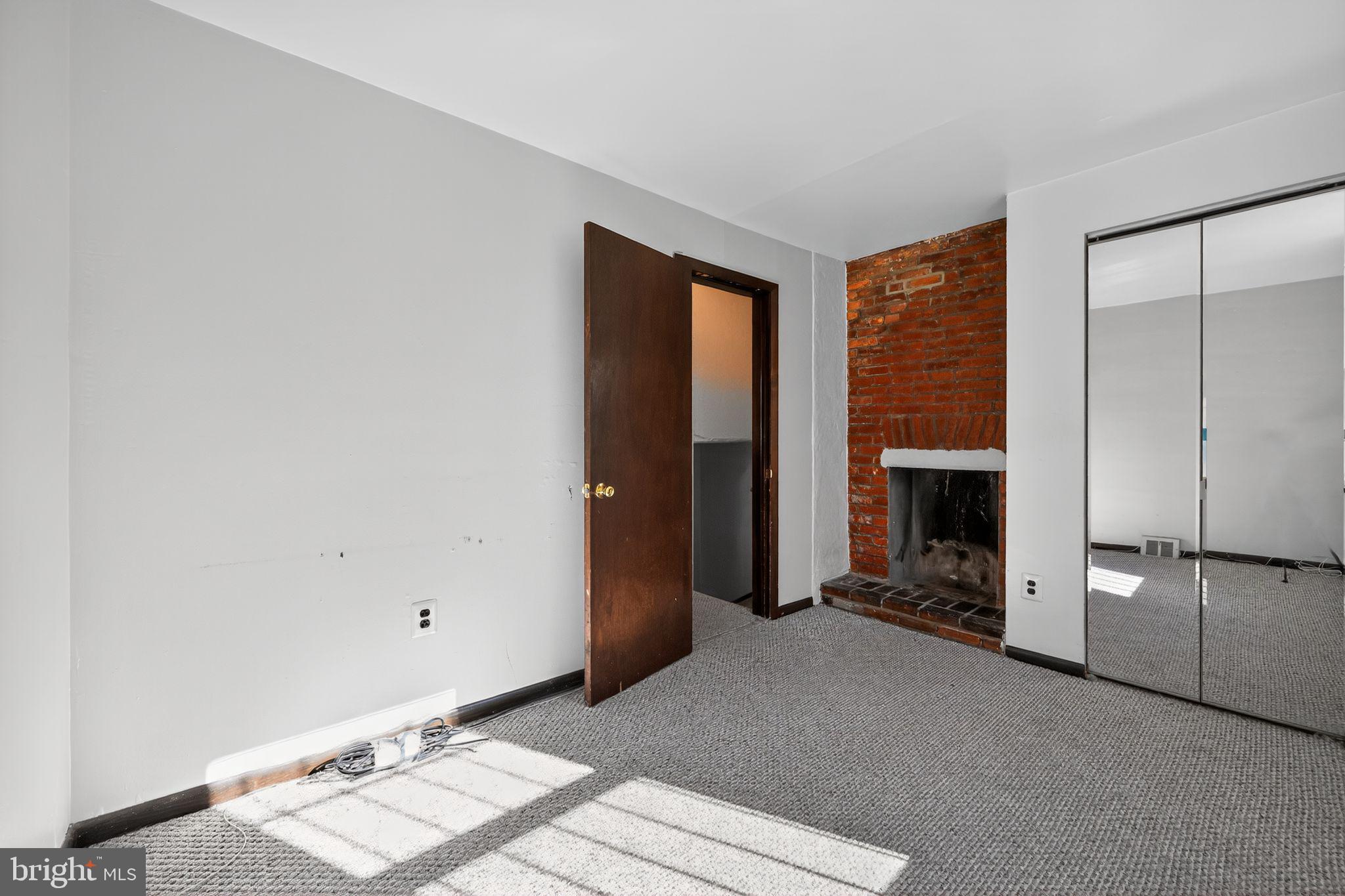 1930 Kater Street Philadelphia, PA 19146 - Photo 19 of 30 a living room with furniture and a fireplace