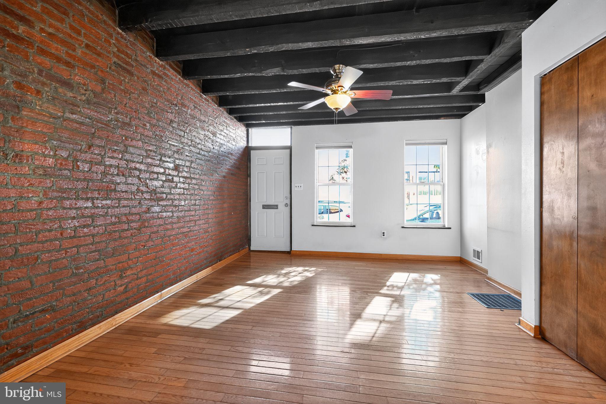 1930 Kater Street Philadelphia, PA 19146 - Photo 20 of 30 a view of empty room with wooden floor and fan