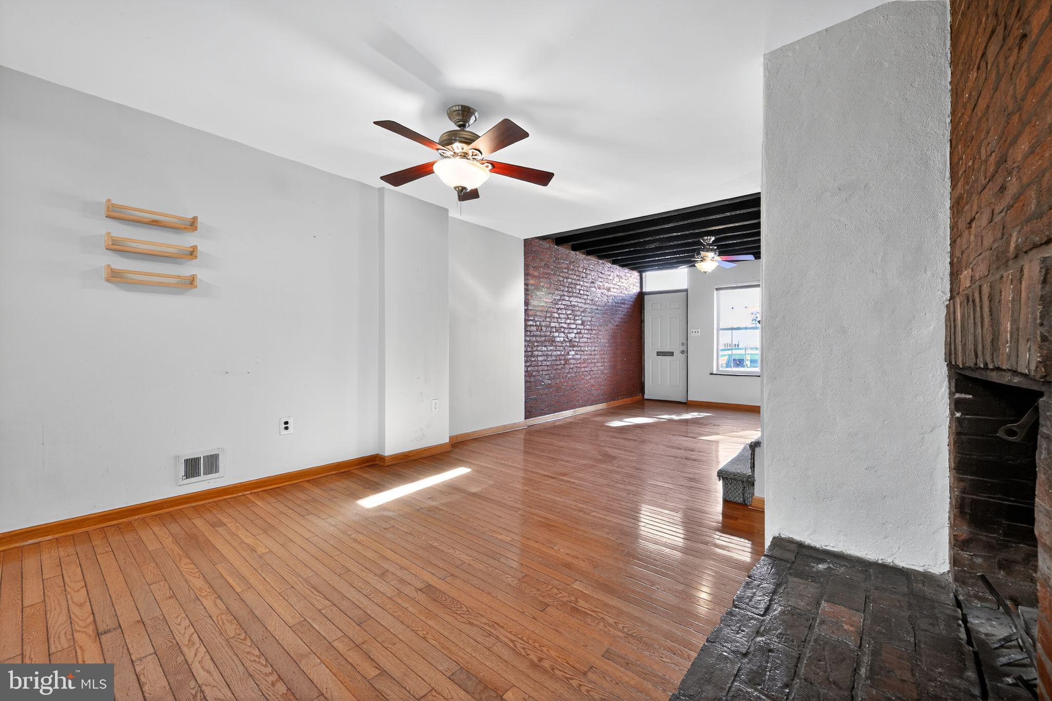 1930 Kater Street Philadelphia, PA 19146 - Photo 21 of 30 a view of empty room with wooden floor and fan