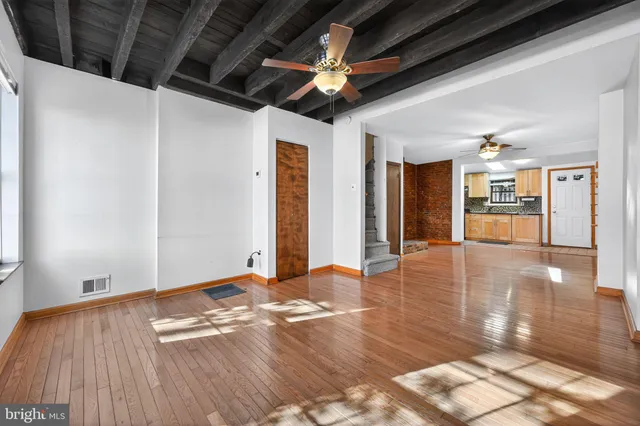a view of a livingroom with wooden floor