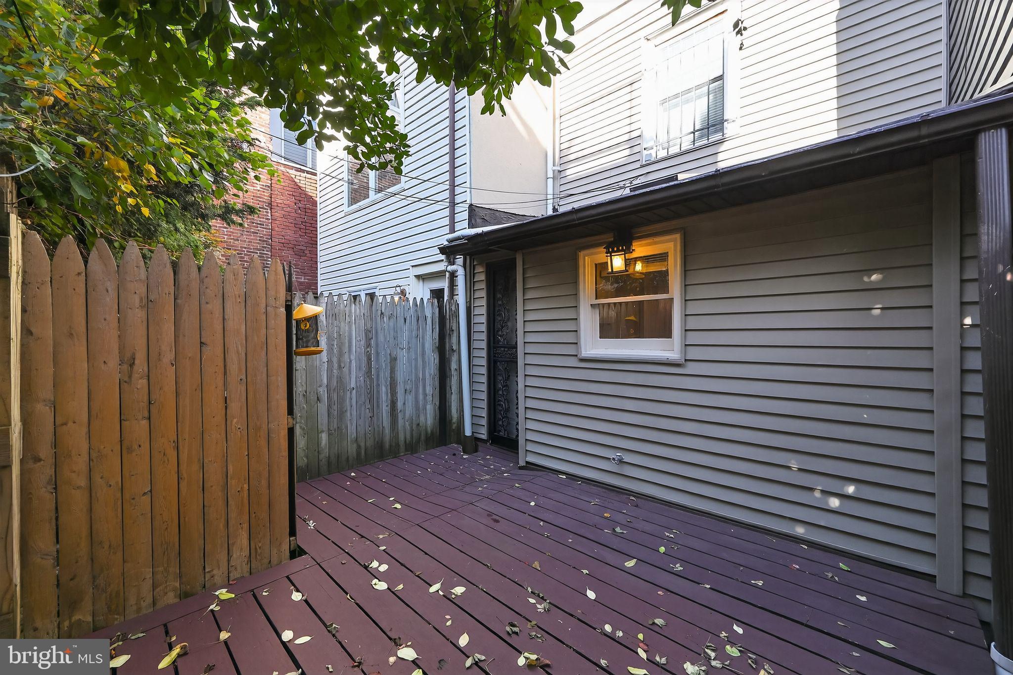 1930 Kater Street Philadelphia, PA 19146 - Photo 30 of 30 a view of a house with a wooden deck