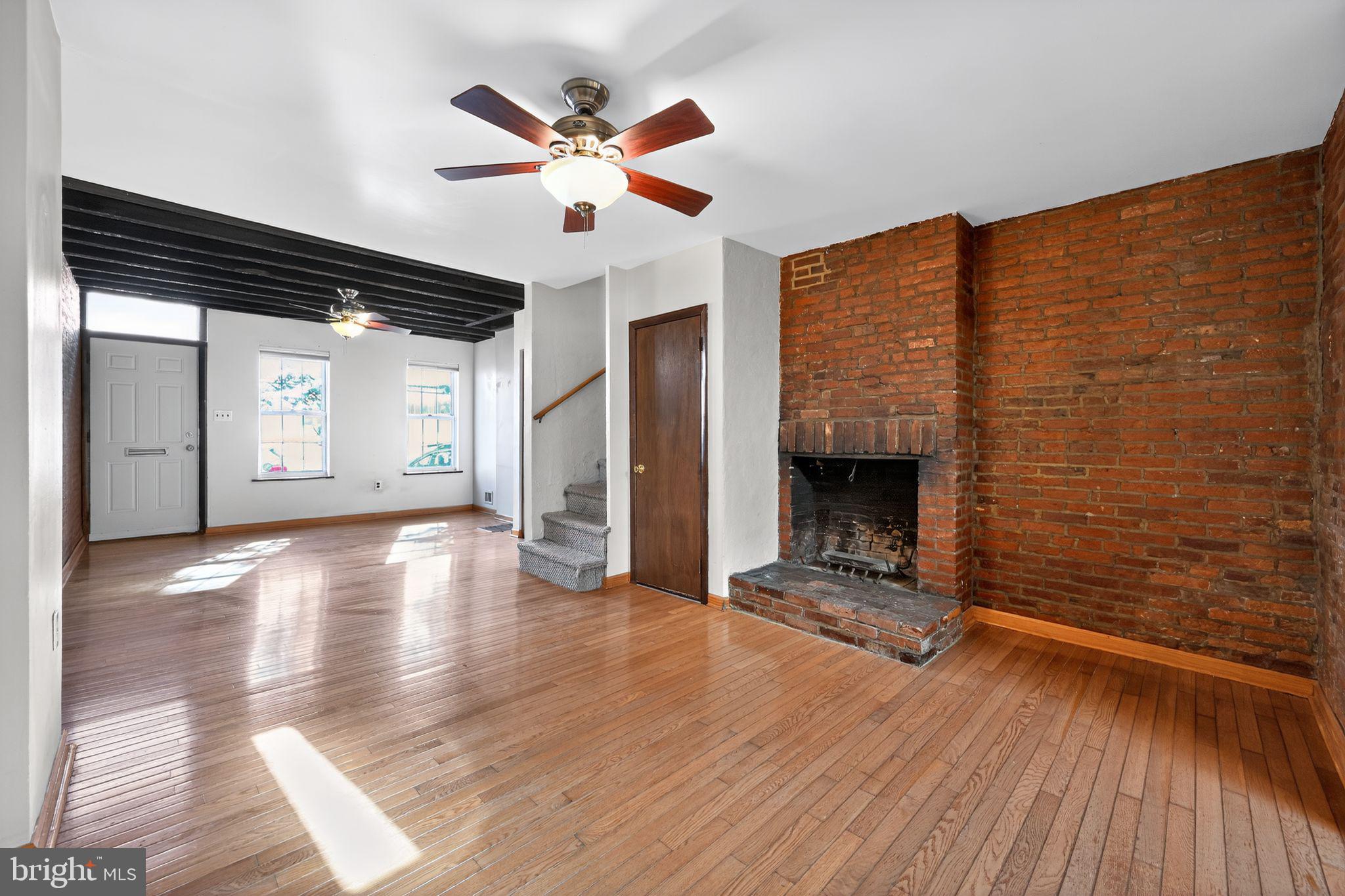 1930 Kater Street Philadelphia, PA 19146 - Photo 6 of 30 wooden floor in an empty room with a fireplace