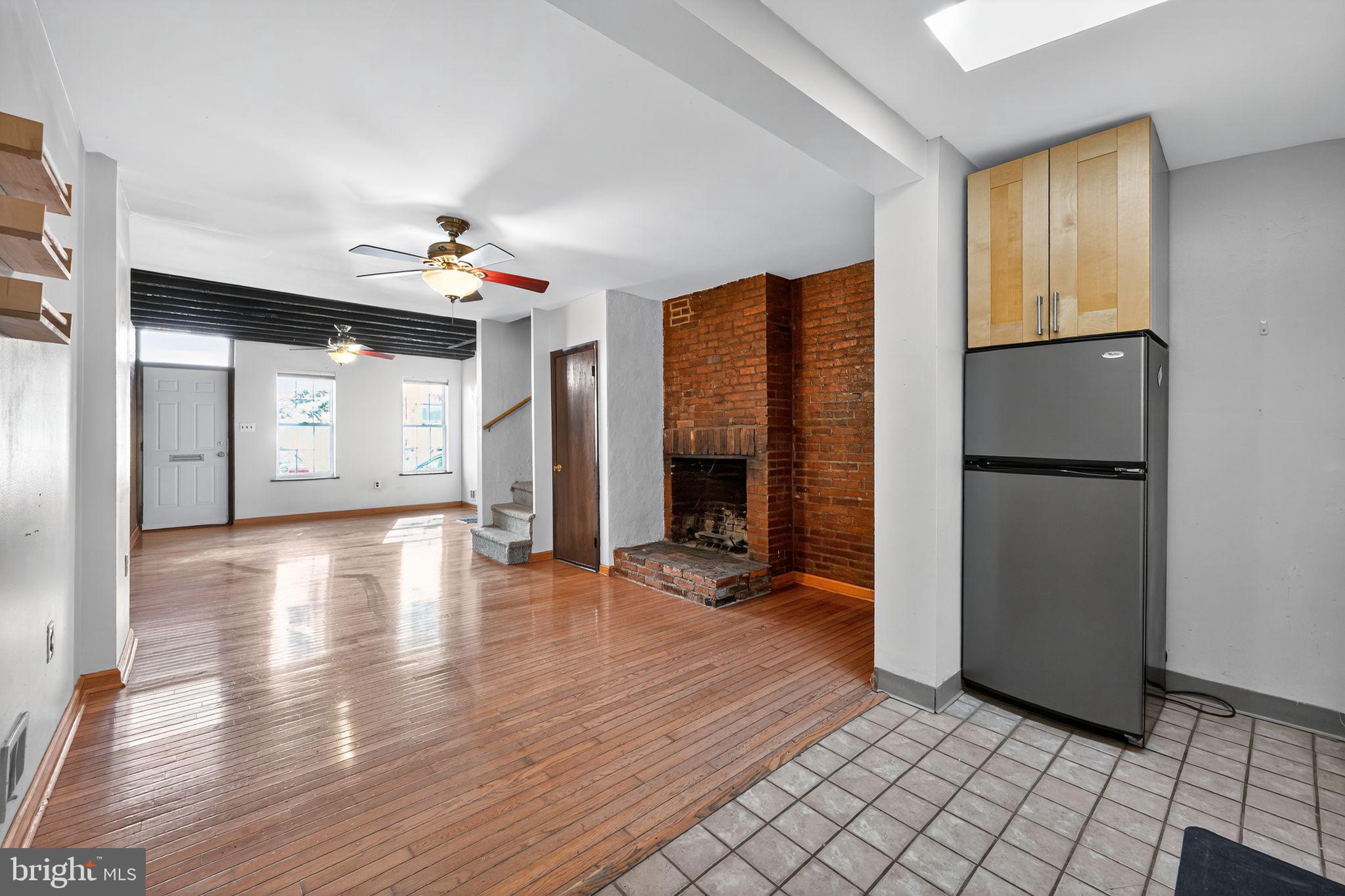 1930 Kater Street Philadelphia, PA 19146 - Photo 8 of 30 a view of a room with wooden floor and a refrigerator