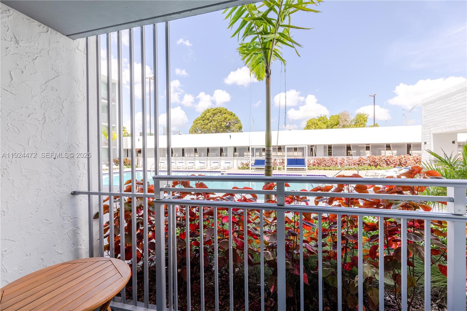 1950 West 49th Street, Unit 402 Hialeah, FL 33012 - Photo 12 of 39 a view of swimming pool with outdoor seating
