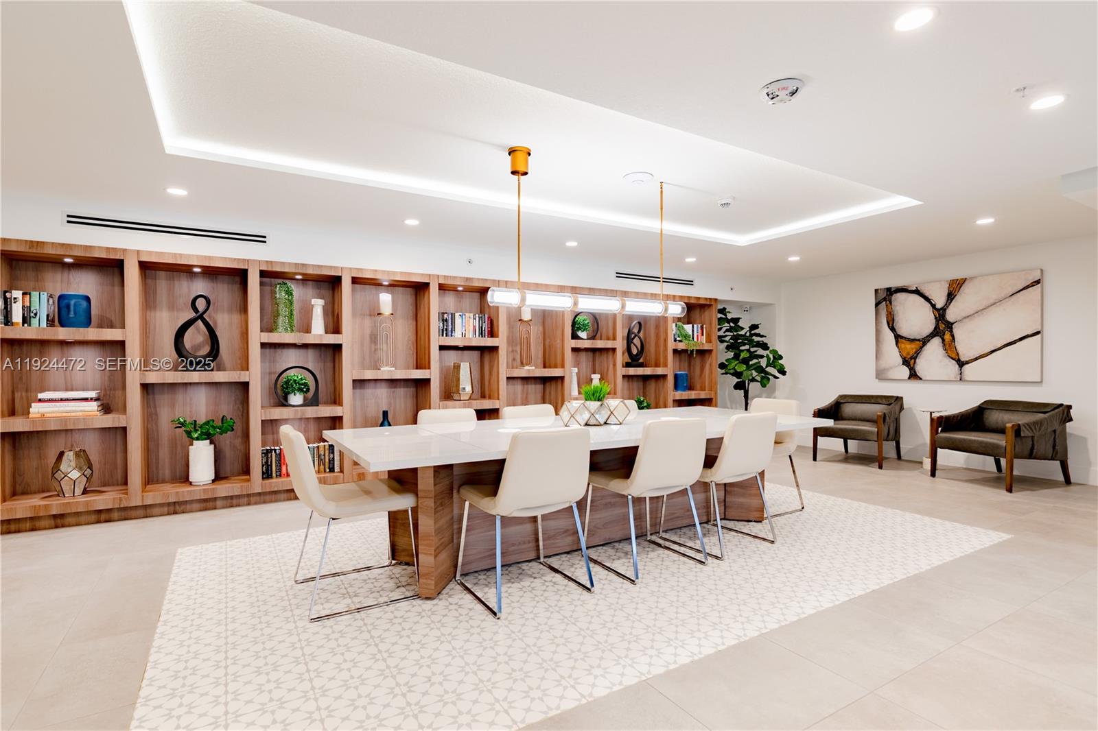 1950 West 49th Street, Unit 402 Hialeah, FL 33012 - Photo 14 of 39 a dining room with stainless steel appliances kitchen island a table and chairs