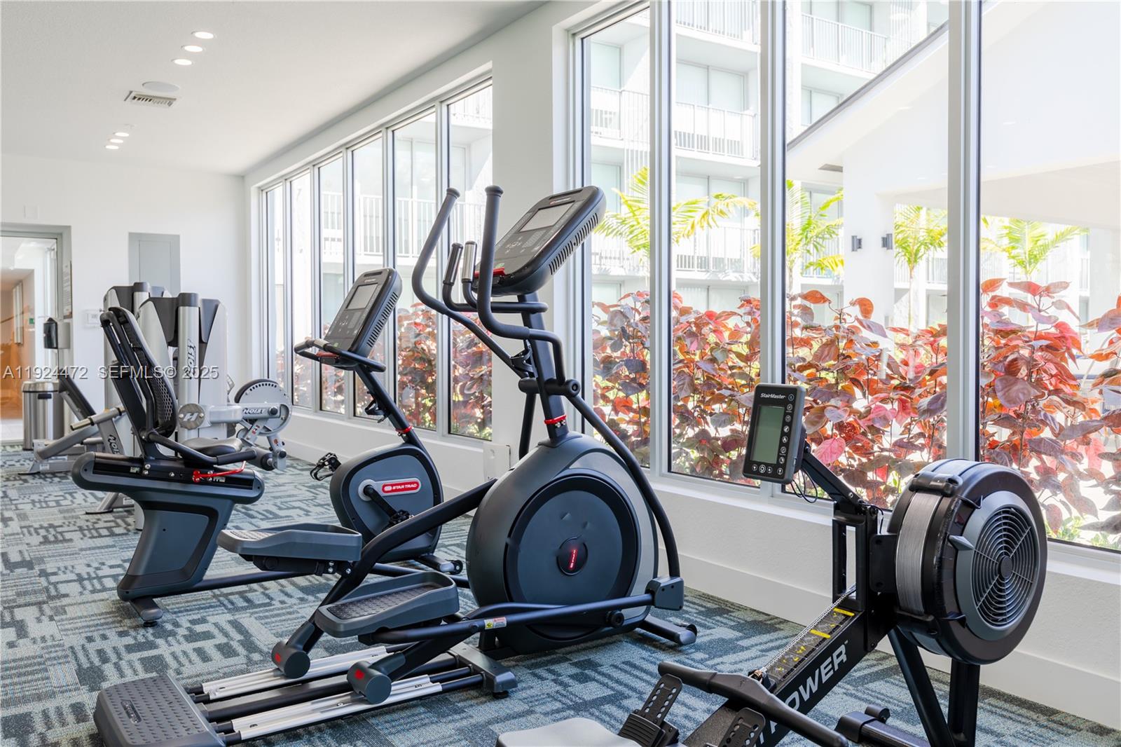 1950 West 49th Street, Unit 402 Hialeah, FL 33012 - Photo 35 of 39 a view of a room with gym equipment