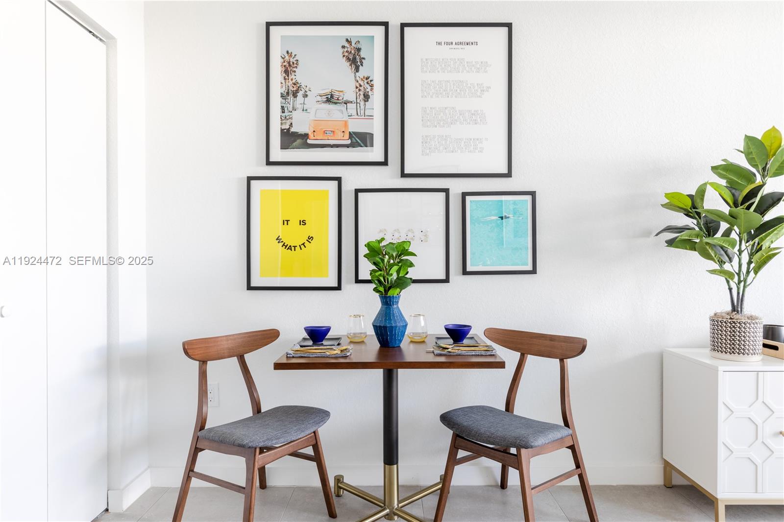 1950 West 49th Street, Unit 402 Hialeah, FL 33012 - Photo 6 of 39 a view of a workspace room with furniture and wooden floor