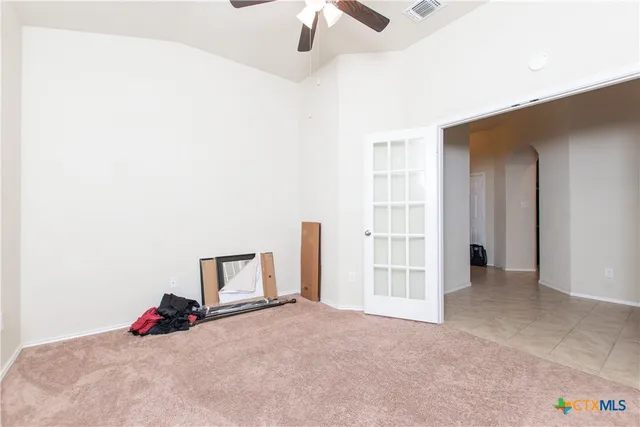 a bed room with a bed and a chair