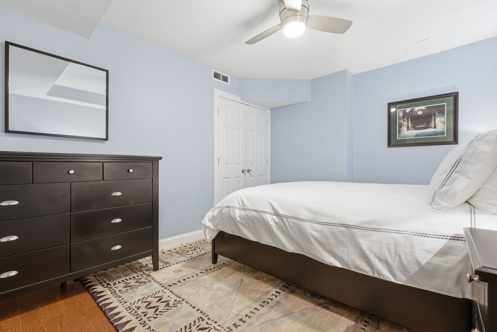 419 Main Street Boston, MA 02129 - Photo 29 of 41 a bed room with a bed and a mirror